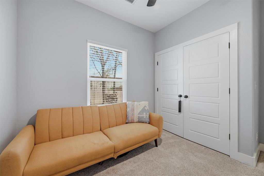 501 Bonham Street Tom Bean, TX 75491 - Photo 27 of 40 a living room with furniture and a window