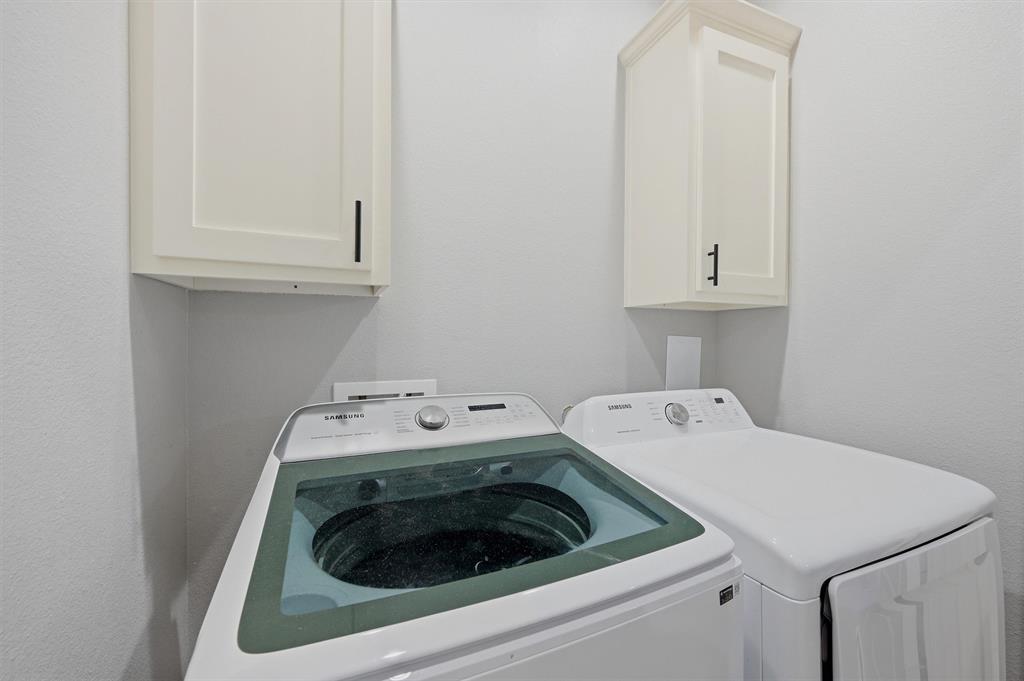 501 Bonham Street Tom Bean, TX 75491 - Photo 31 of 40 a utility room with dryer and washer