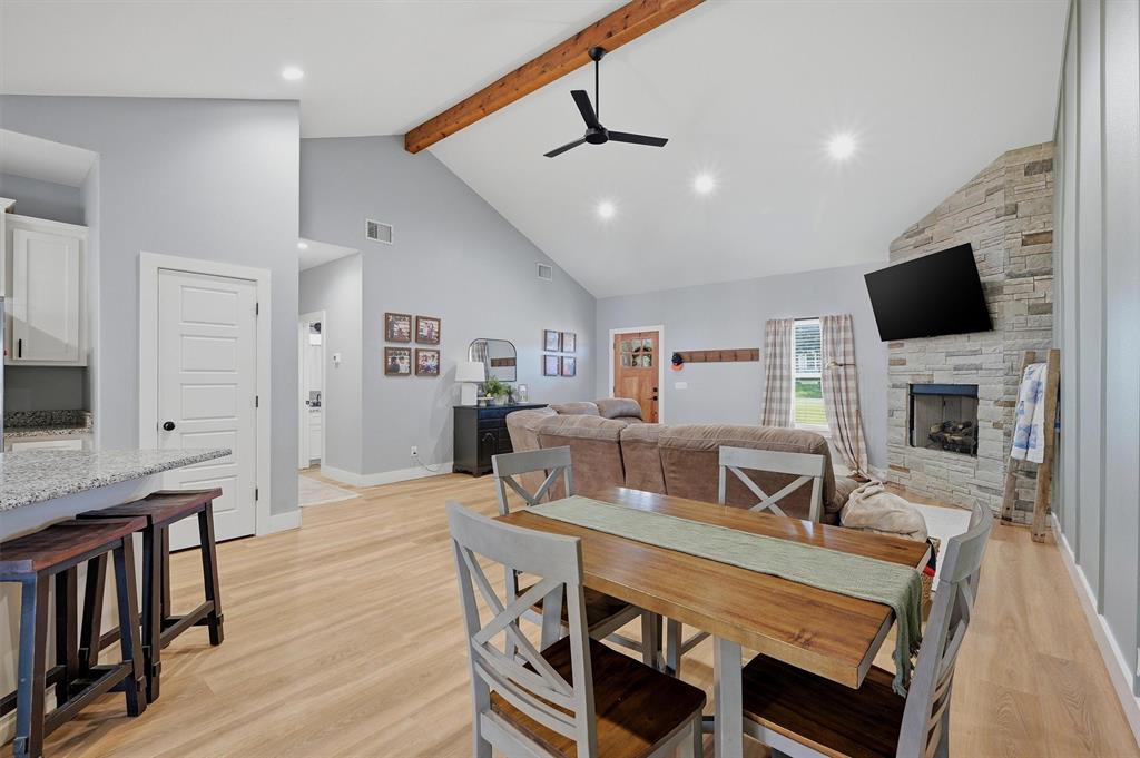 501 Bonham Street Tom Bean, TX 75491 - Photo 9 of 40 a view of a dining room with furniture a rug and wooden floor