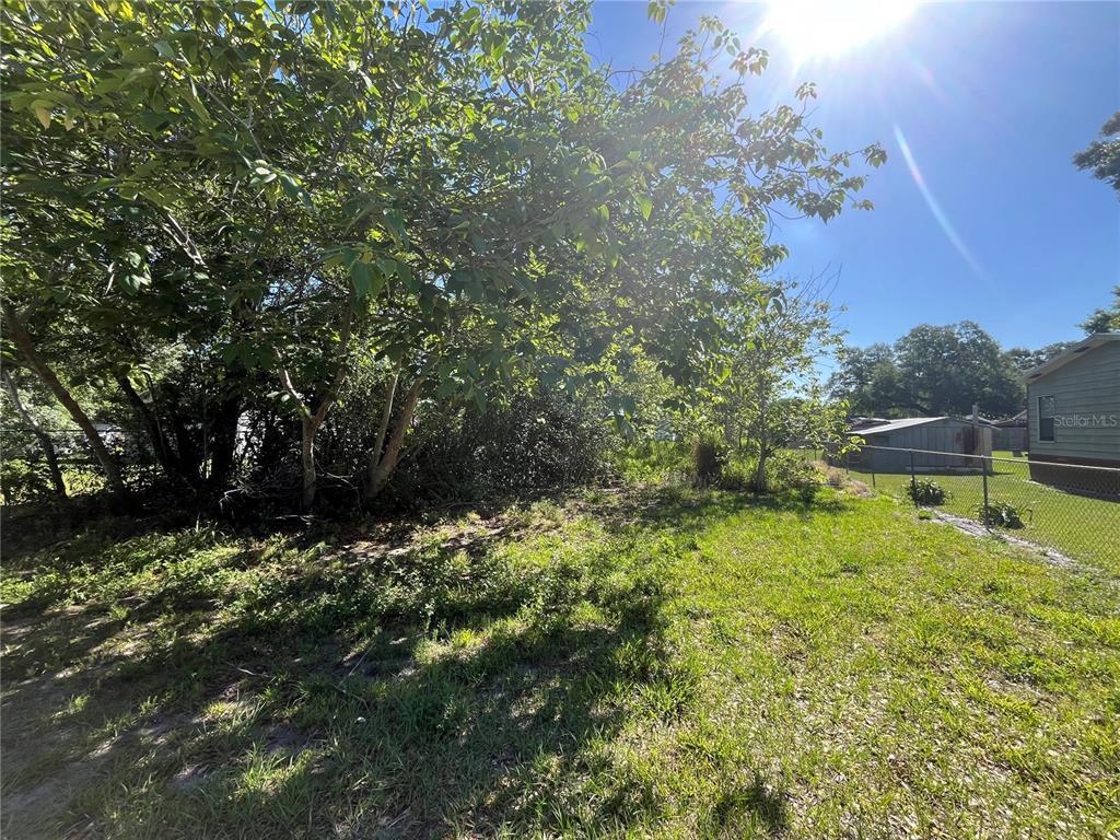a view of a backyard of a house