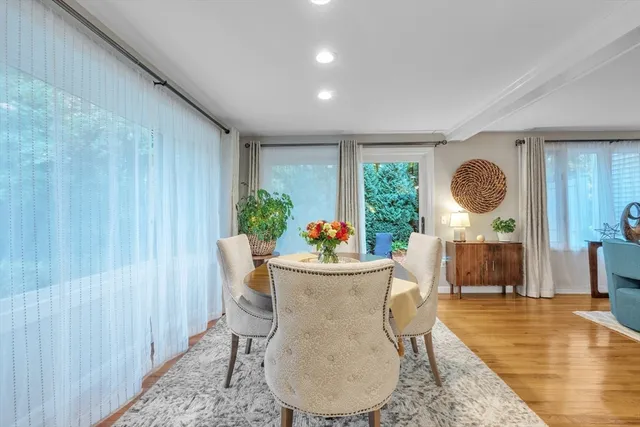 a view of a dining room with furniture window and outside view