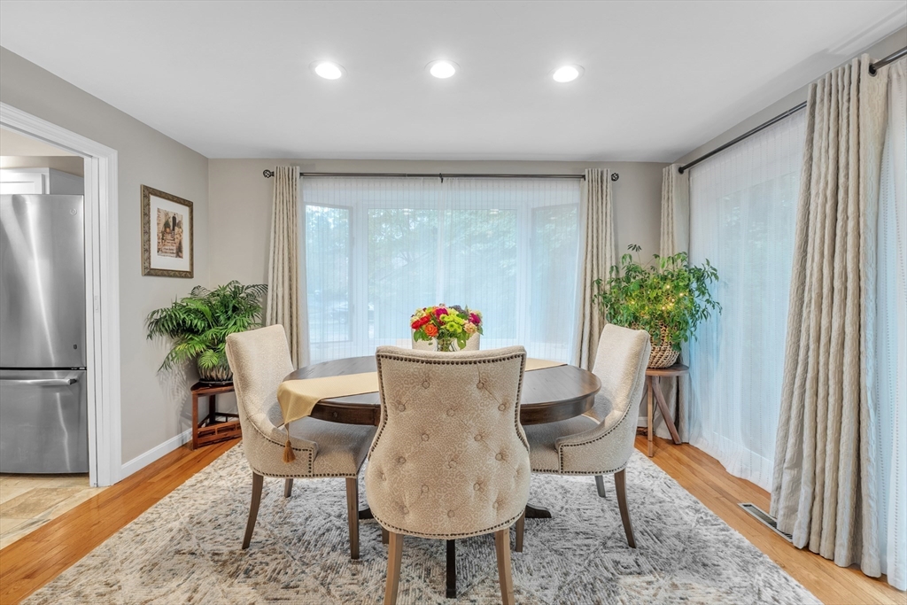 770 Salisbury Street, Unit 201 Worcester, MA 01609 - Photo 13 of 42 a view of a dining room with furniture window and wooden floor