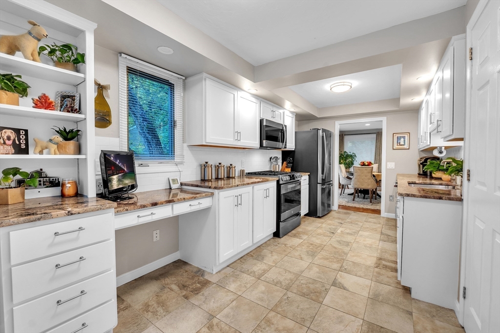 770 Salisbury Street, Unit 201 Worcester, MA 01609 - Photo 14 of 42 a kitchen with a sink window and cabinets