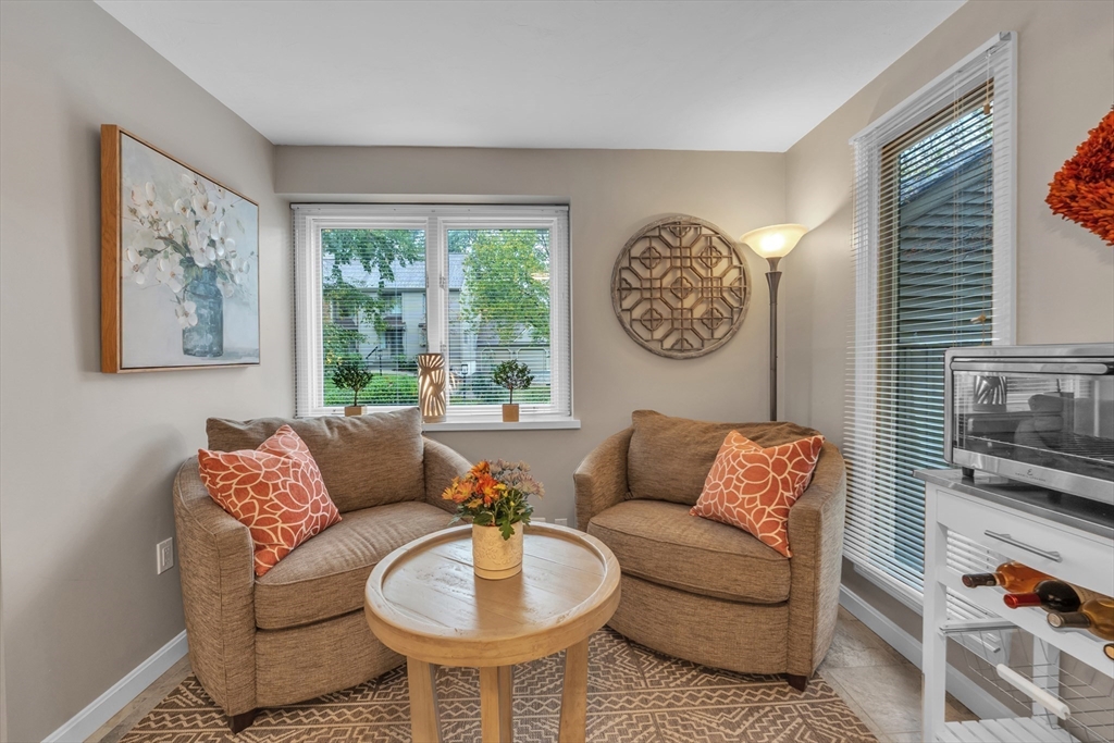 770 Salisbury Street, Unit 201 Worcester, MA 01609 - Photo 18 of 42 a living room with furniture and a large window