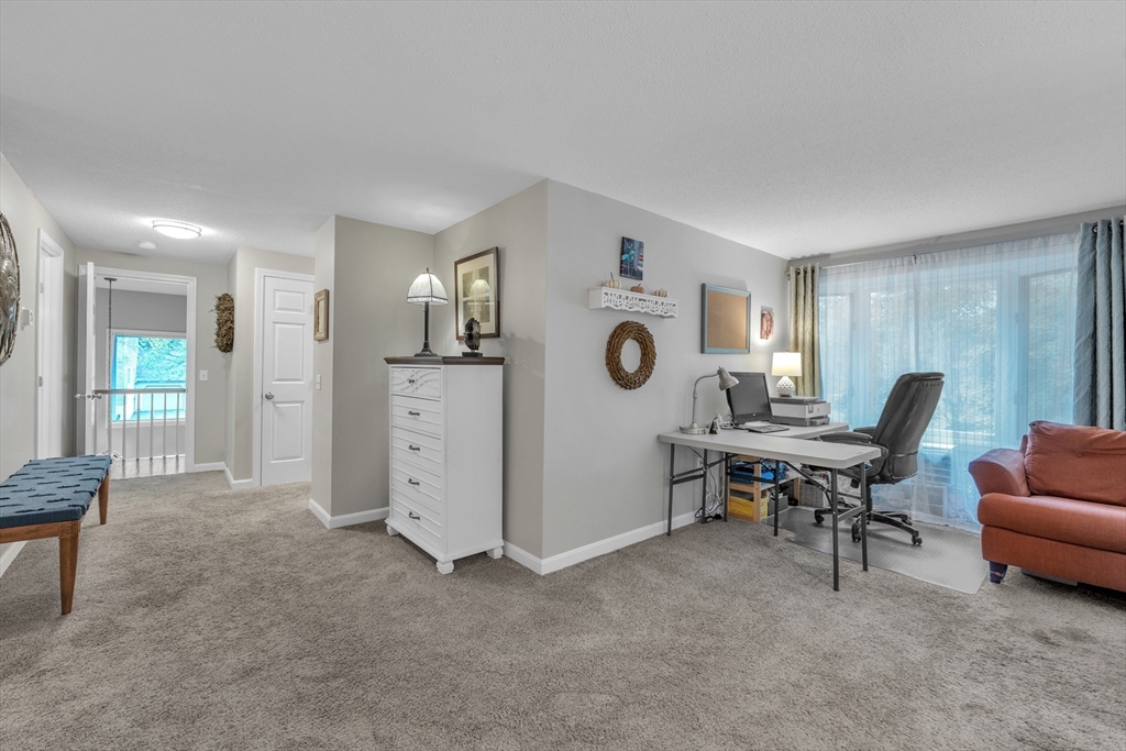 770 Salisbury Street, Unit 201 Worcester, MA 01609 - Photo 22 of 42 a view of a livingroom with furniture and windows