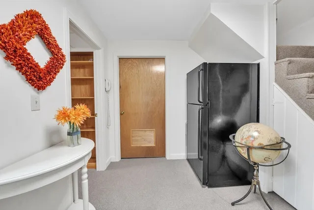a view of hallway with livingroom and furniture