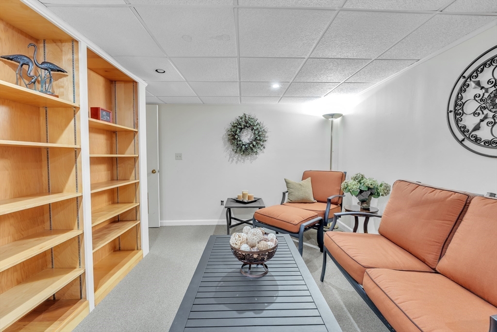 770 Salisbury Street, Unit 201 Worcester, MA 01609 - Photo 30 of 42 a living room with furniture and a rug