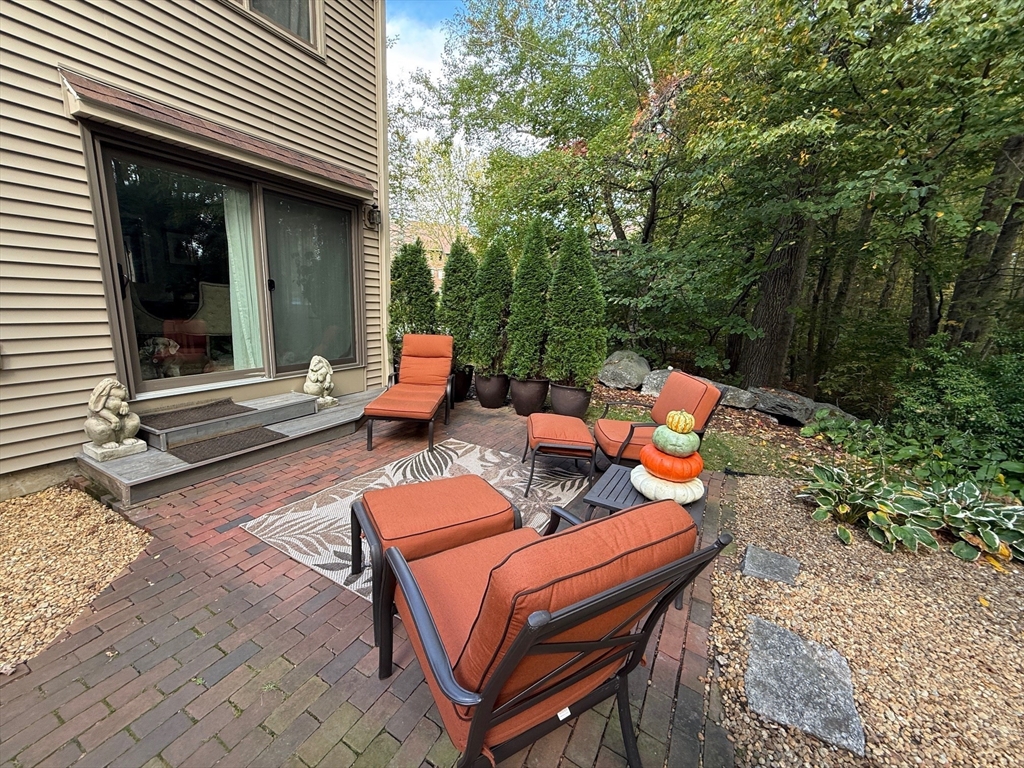 770 Salisbury Street, Unit 201 Worcester, MA 01609 - Photo 32 of 42 a backyard of a house with outdoor seating