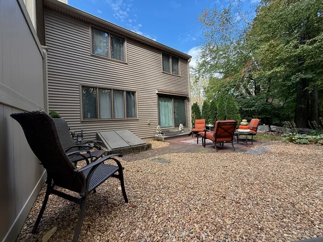 a view of a backyard with sitting area