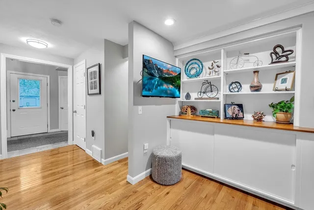 a view of kitchen with furniture and wooden floor