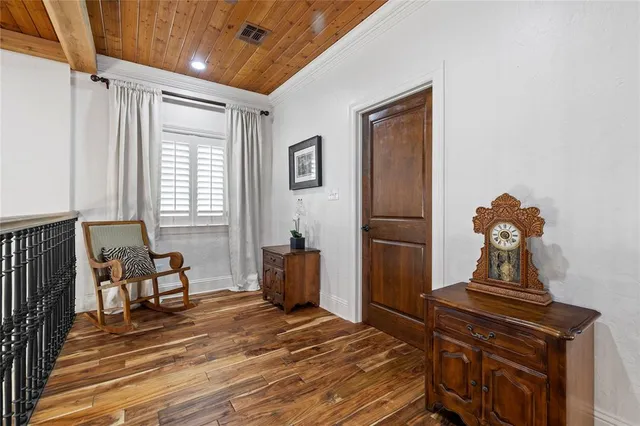 a living room with furniture and next to a window