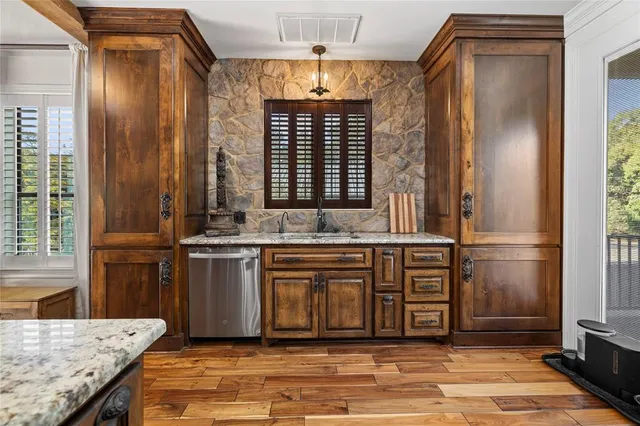 a view of a kitchen with a sink and a window