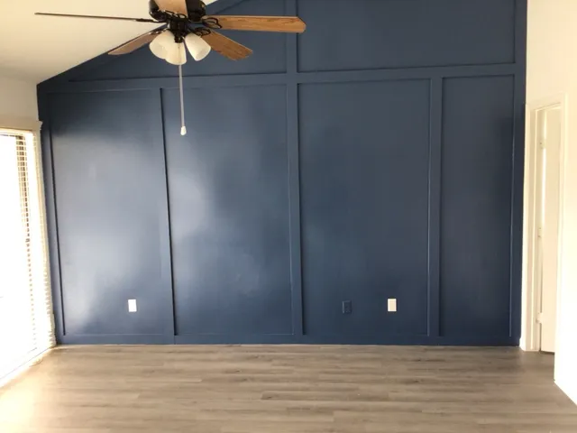 a view of an empty room and window