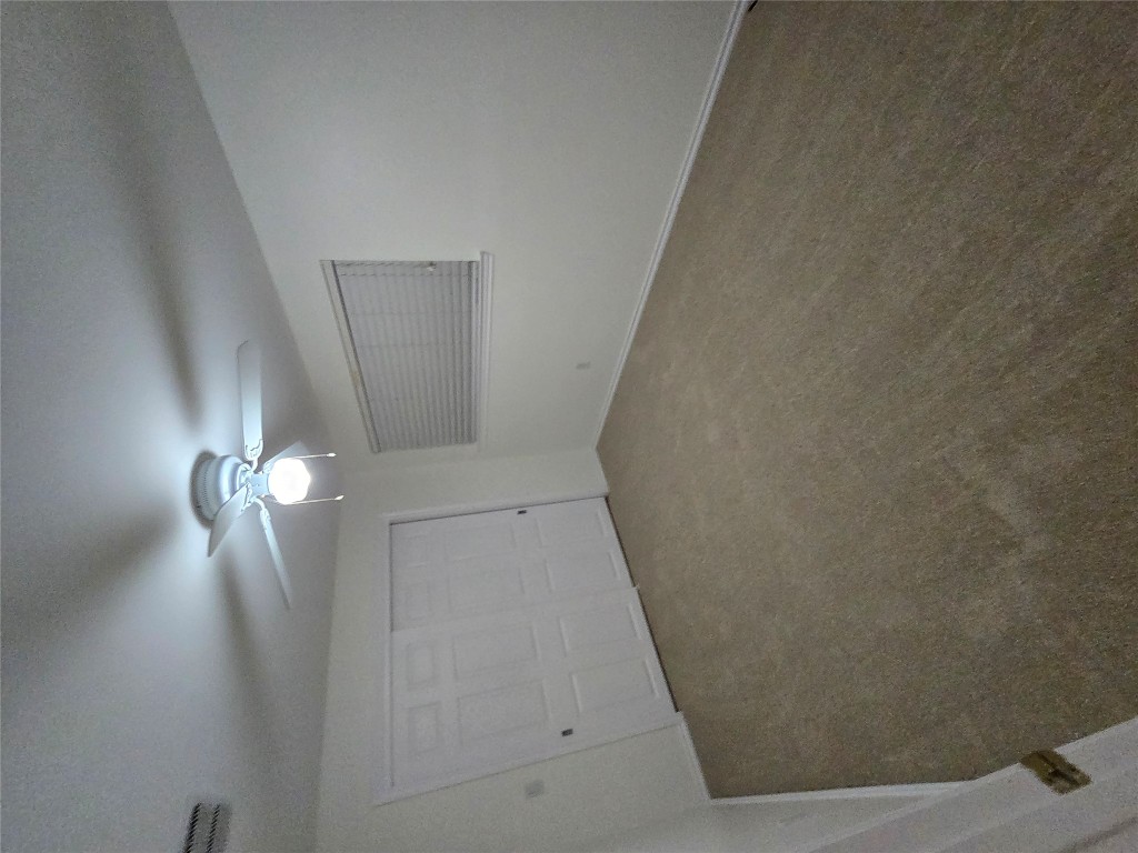 8511 Ephraim Road Austin, TX 78717 - Photo 11 of 14 an empty room with a chandelier fan