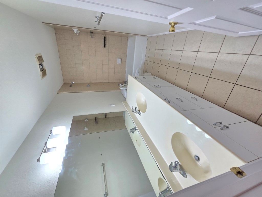 8511 Ephraim Road Austin, TX 78717 - Photo 13 of 14 a bathroom with a double vanity sink and mirror
