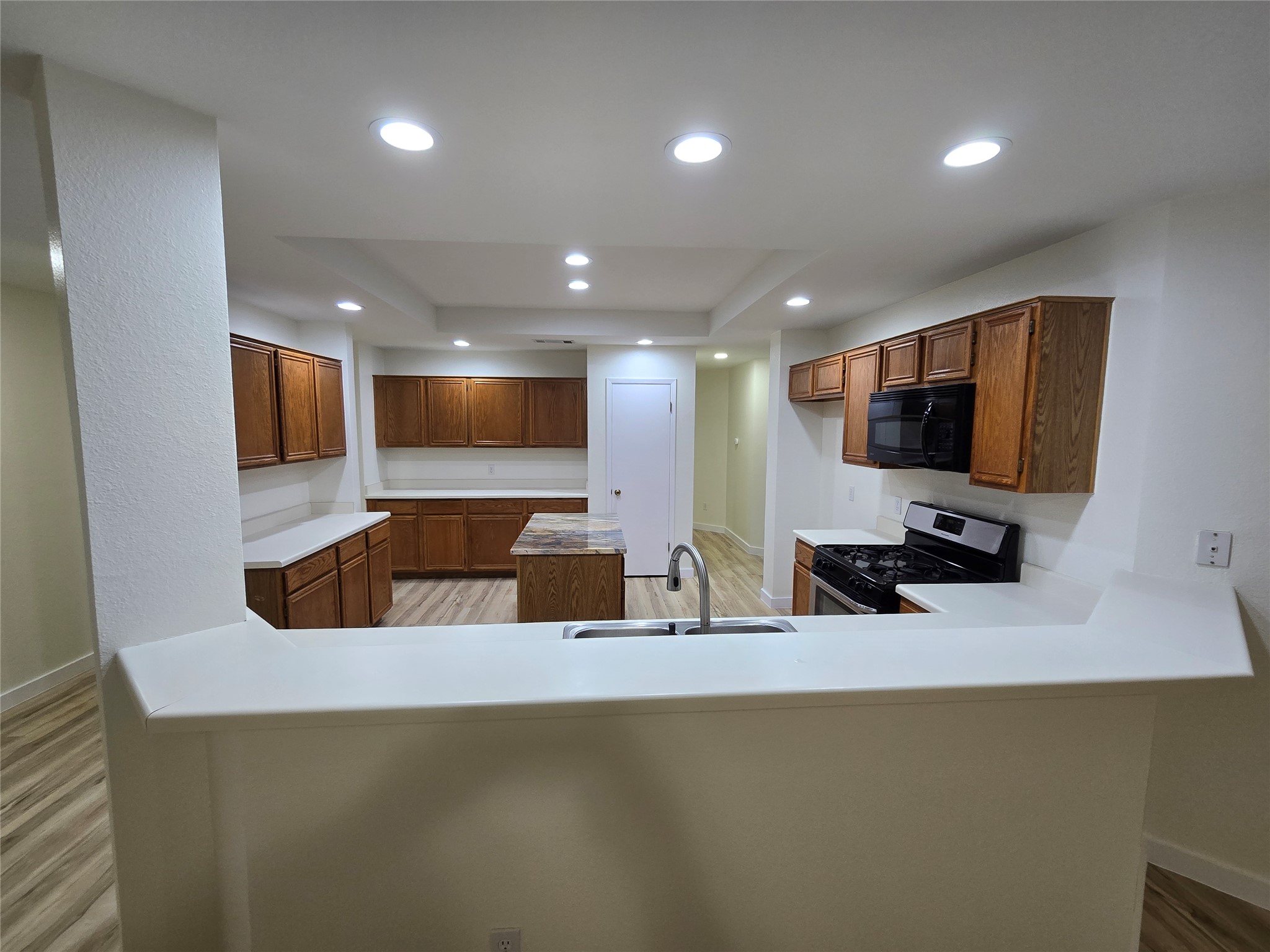 8511 Ephraim Road Austin, TX 78717 - Photo 5 of 14 a kitchen with a sink and a microwave