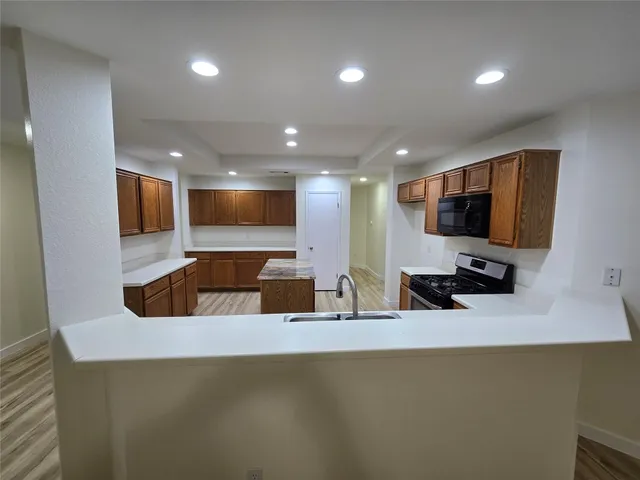 a kitchen with a sink and a microwave