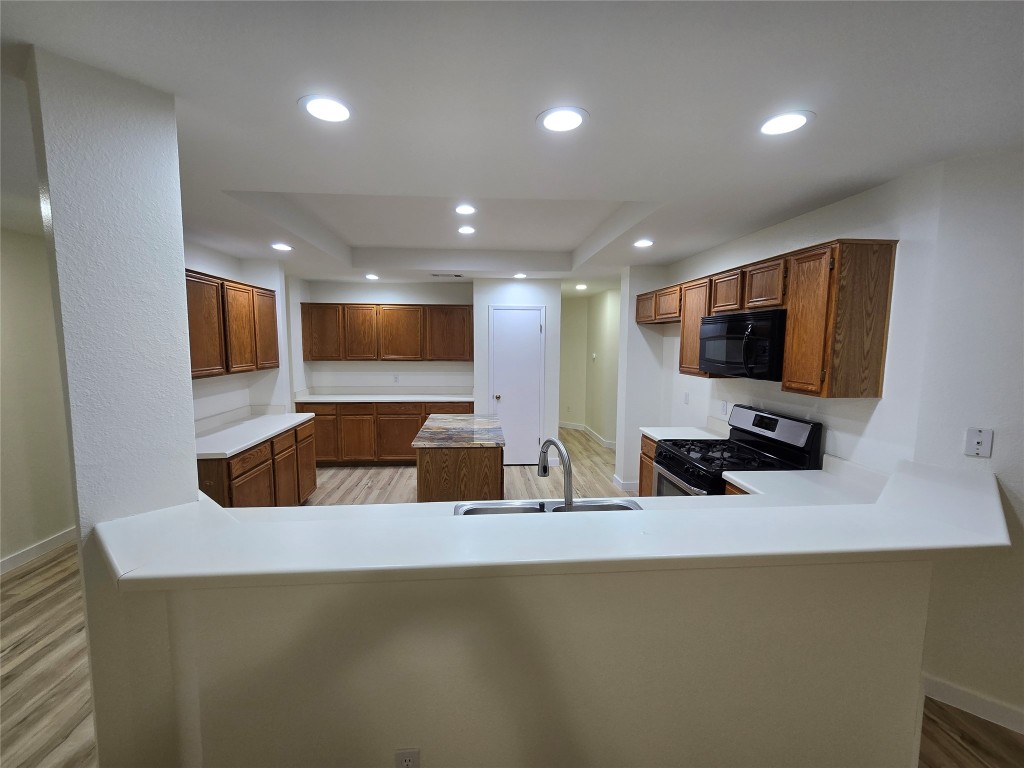 8511 Ephraim Road Austin, TX 78717 - Photo 5 of 14 a kitchen with a sink and a microwave