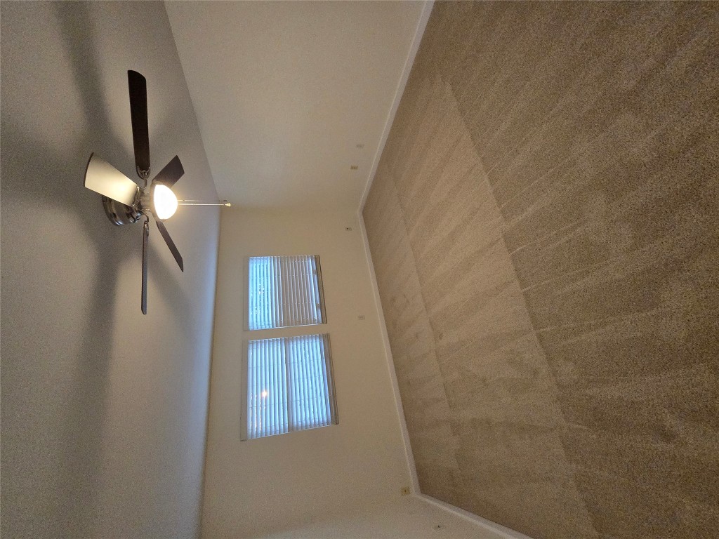 8511 Ephraim Road Austin, TX 78717 - Photo 6 of 14 an empty room with ceiling fan and window