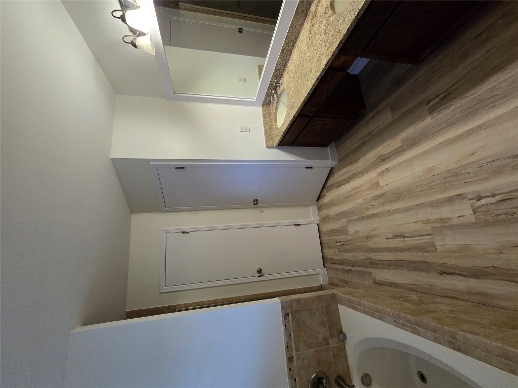 8511 Ephraim Road Austin, TX 78717 - Photo 7 of 14 a spacious bathroom with a sink and a granite counter tops