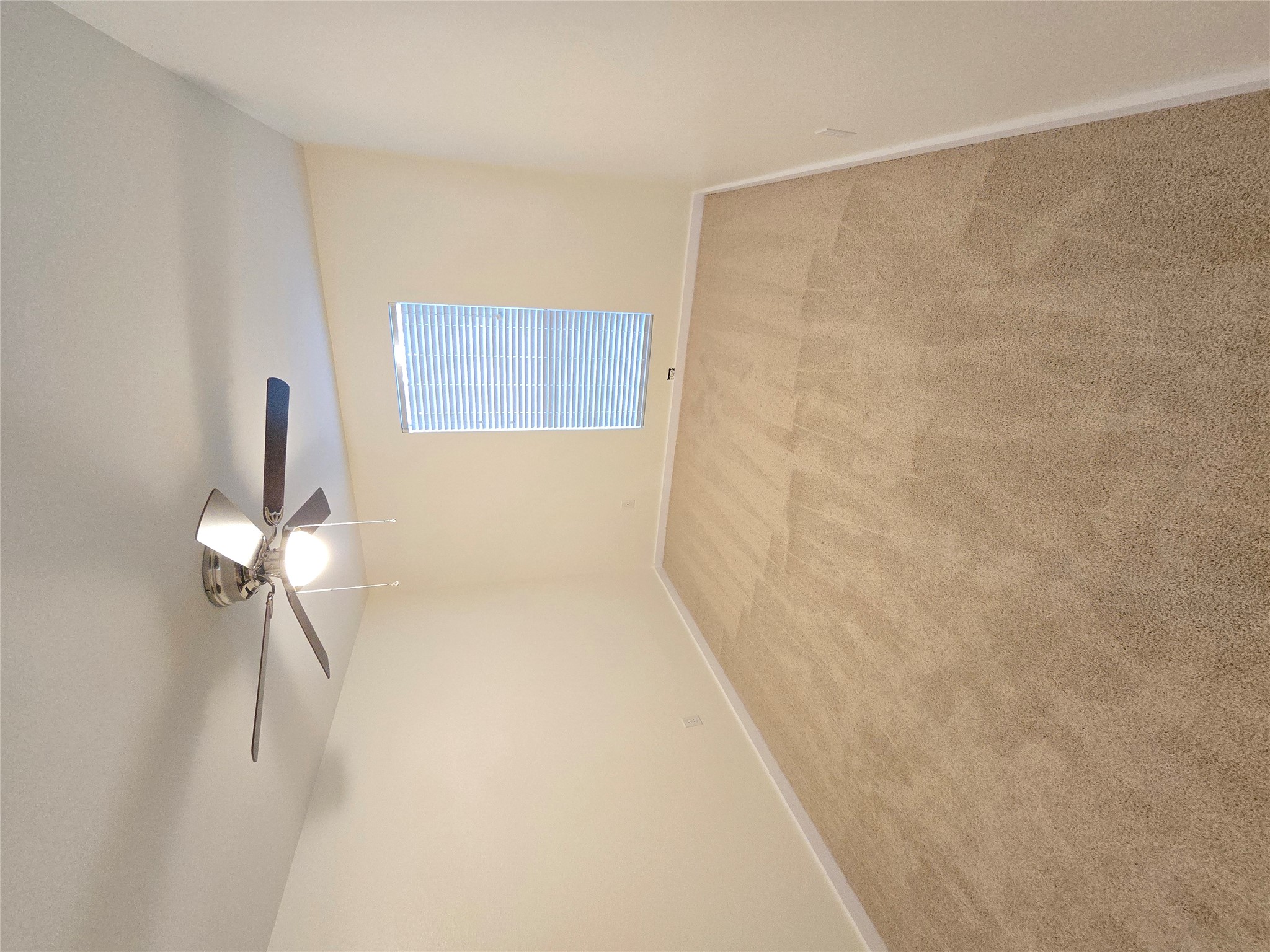 8511 Ephraim Road Austin, TX 78717 - Photo 9 of 14 an empty room with windows and fan