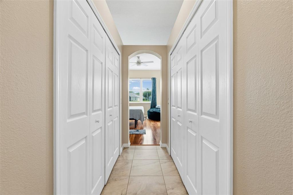 11808 Soft Rush Terrace Lakewood Ranch, FL 34202 - Photo 32 of 71 a view of a hallway with large windows and front door