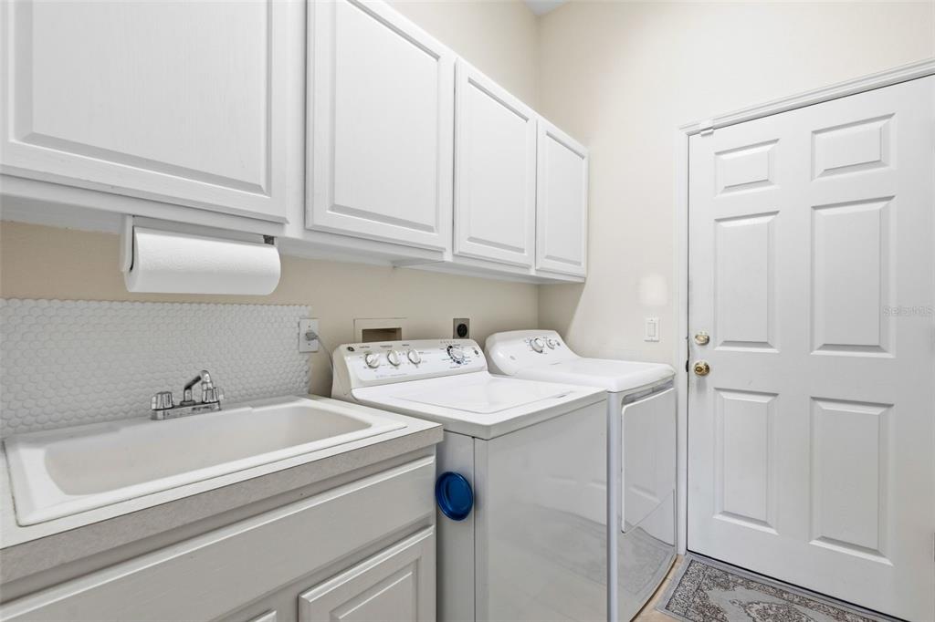 11808 Soft Rush Terrace Lakewood Ranch, FL 34202 - Photo 48 of 71 a utility room with dryer and washer