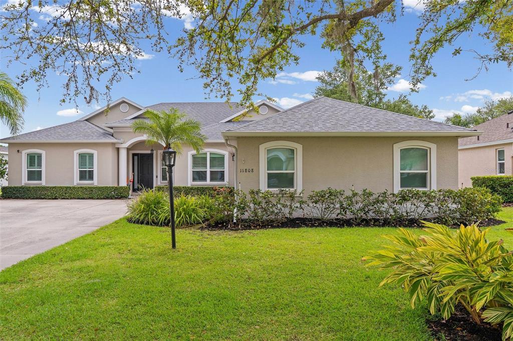 11808 Soft Rush Terrace Lakewood Ranch, FL 34202 - Photo 60 of 71 a front view of house with yard and green space