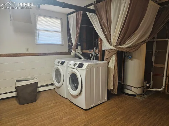 a view of a livingroom with furniture and a window
