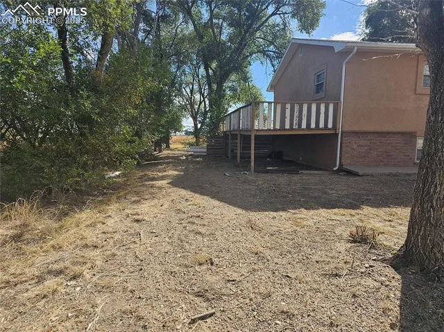 a view of a swimming pool with an outdoor space and seating area