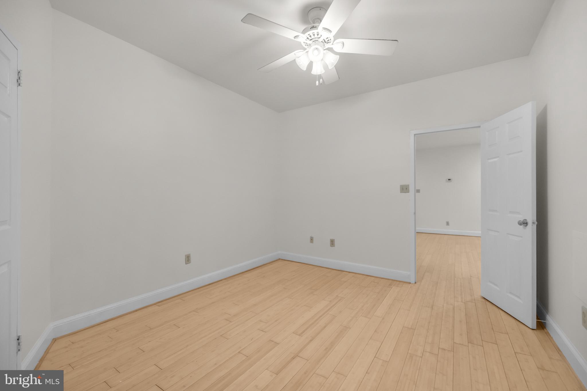 1115 12th Street Northwest, Unit 104 Washington, DC 20005 - Photo 13 of 25 wooden floor in an empty room