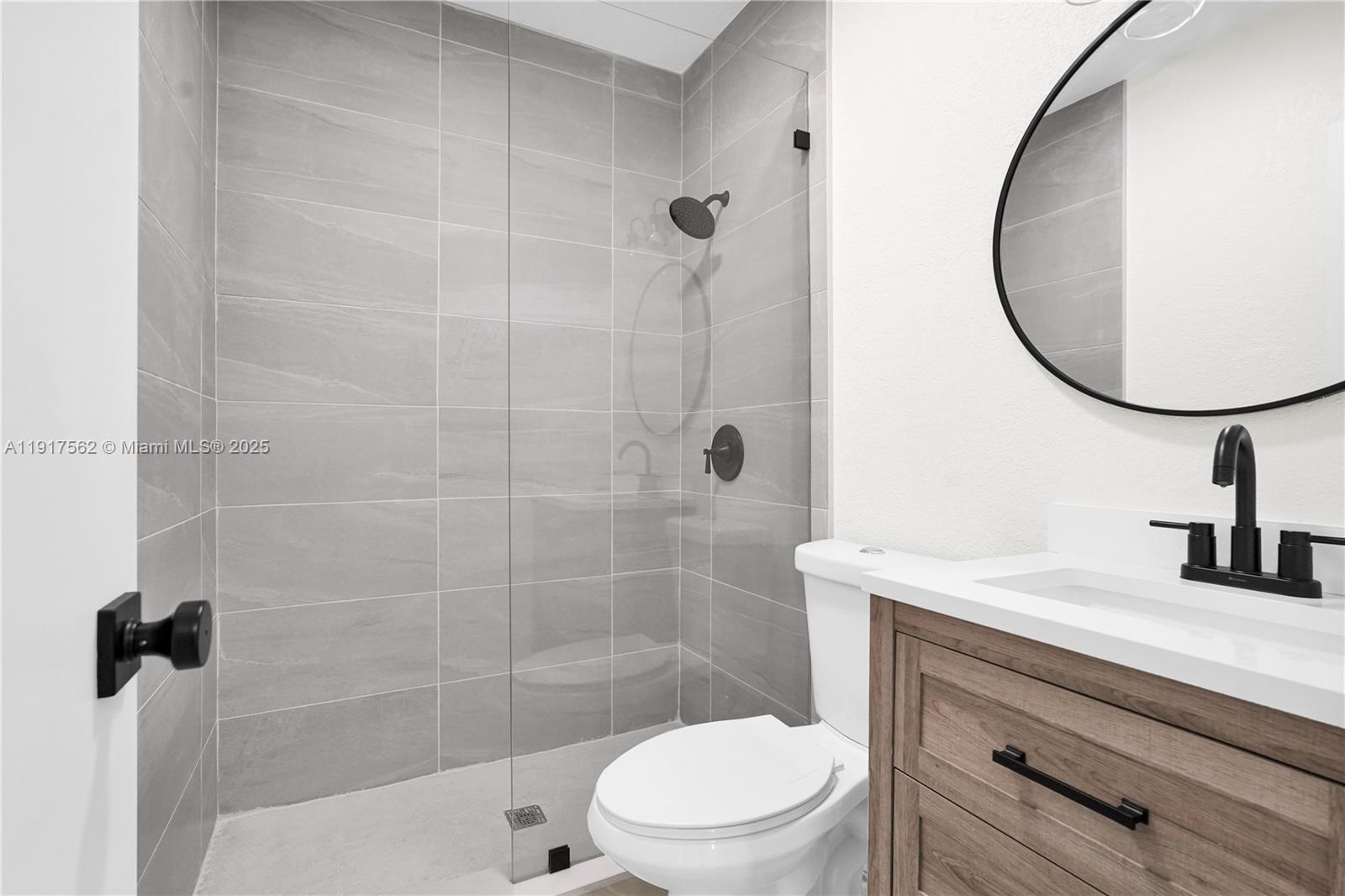 88 Southwest 29th Avenue Miami, FL 33135 - Photo 16 of 30 a bathroom with a sink a toilet and a mirror