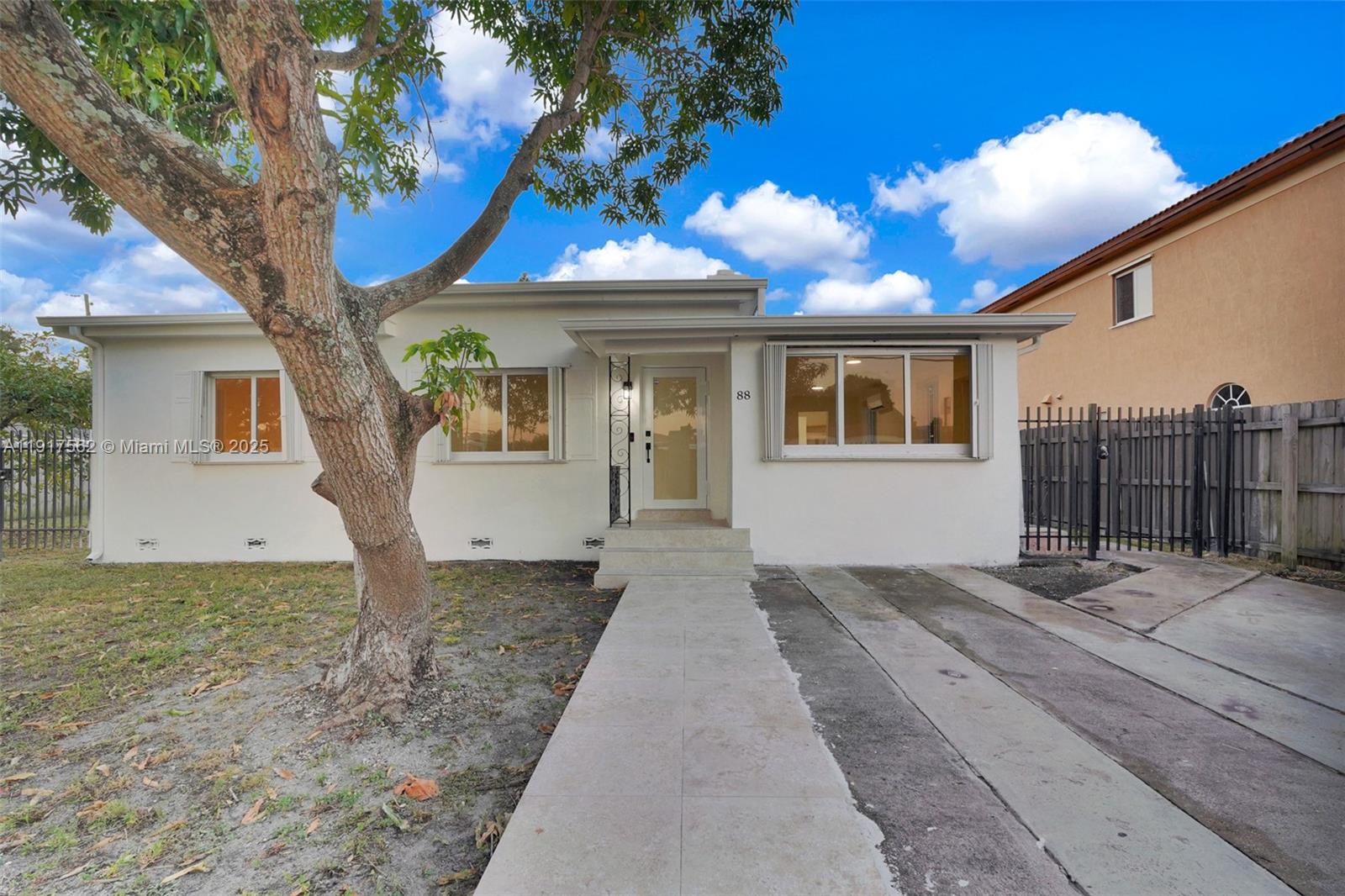 88 Southwest 29th Avenue Miami, FL 33135 - Photo 2 of 30 a front view of a house with a yard