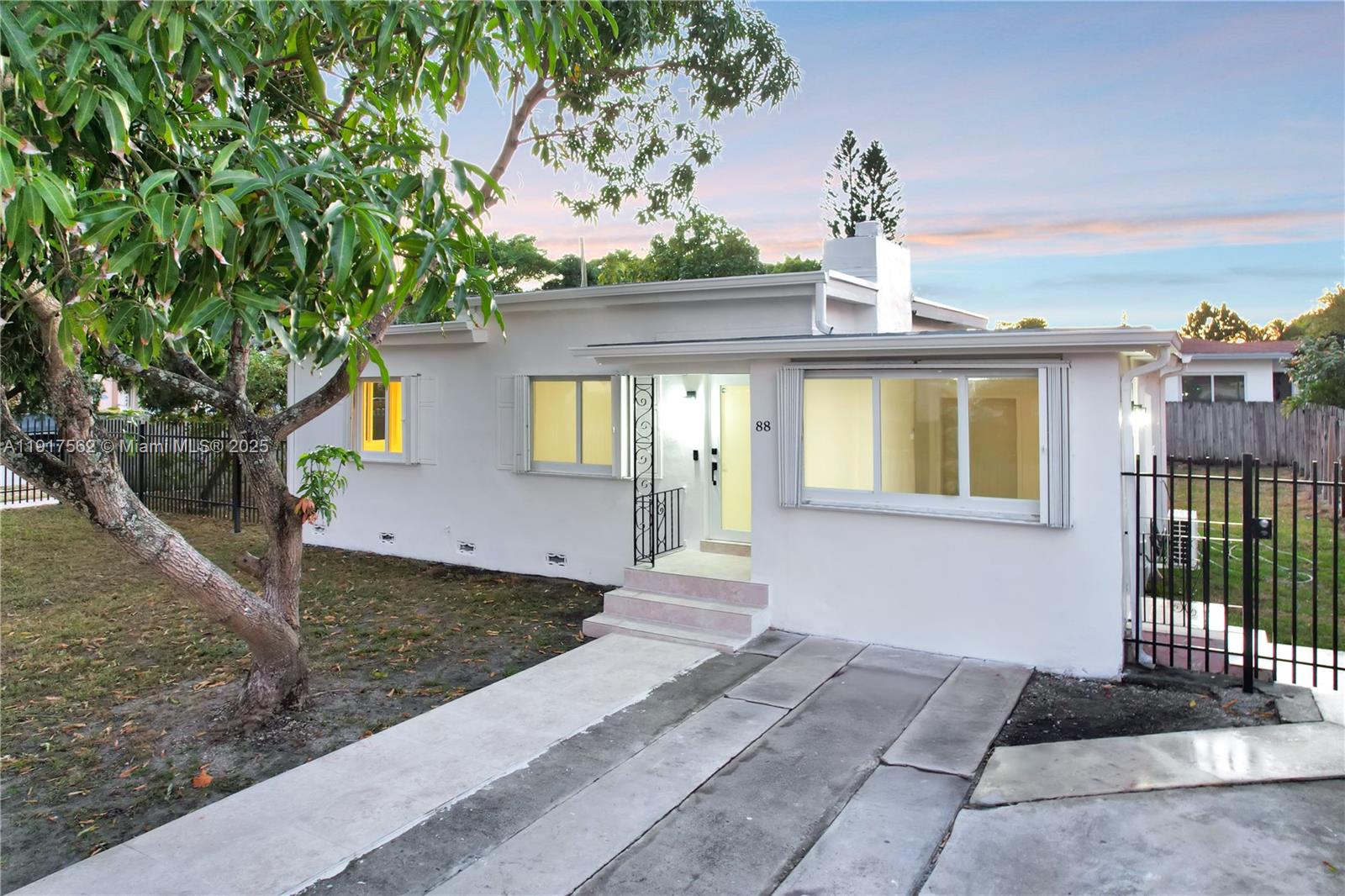 88 Southwest 29th Avenue Miami, FL 33135 - Photo 5 of 30 a front view of a house with a yard