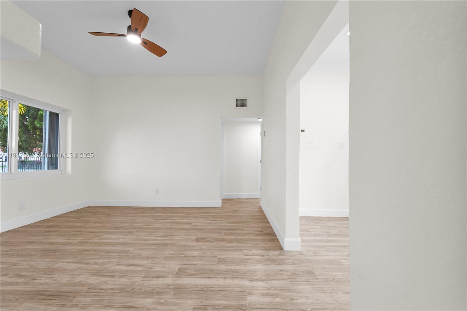 88 Southwest 29th Avenue Miami, FL 33135 - Photo 9 of 30 a view of empty room with wooden floor and fan