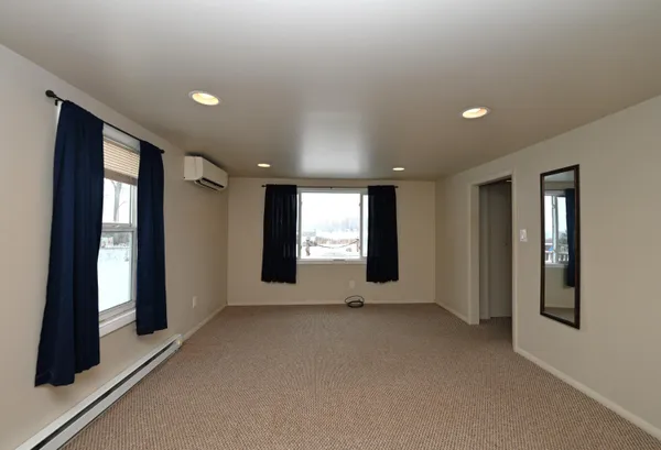 a view of an empty room with a window