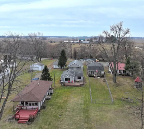 an aerial view of a house with garden space ocean view