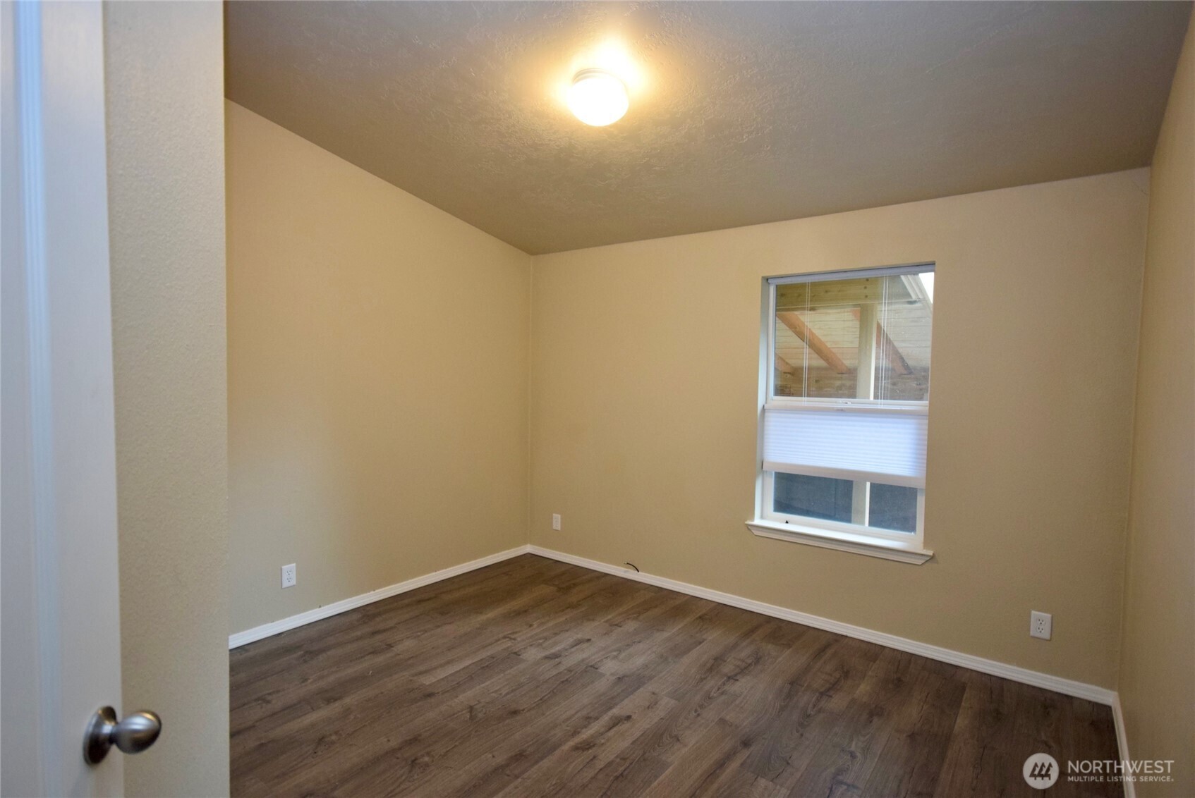 375 Dungeness Meadows Sequim, WA 98382 - Photo 14 of 27 an empty room with wooden floor and windows