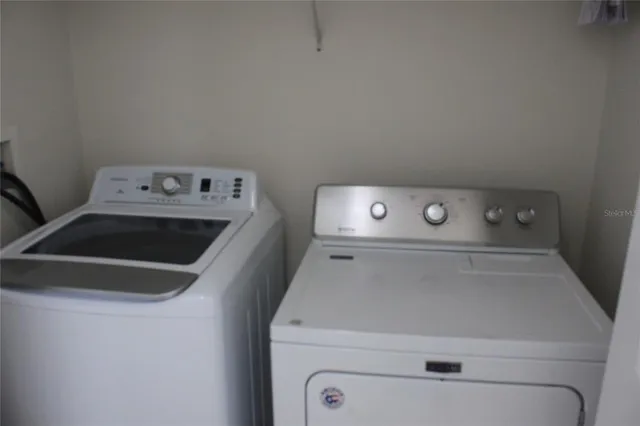 a utility room with dryer and washer