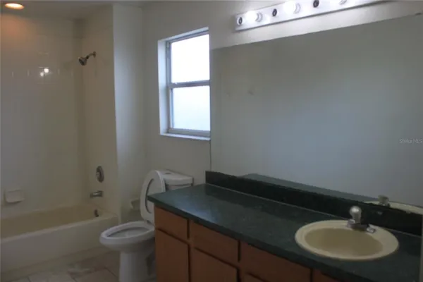 a bathroom with a sink a toilet and a bathtub