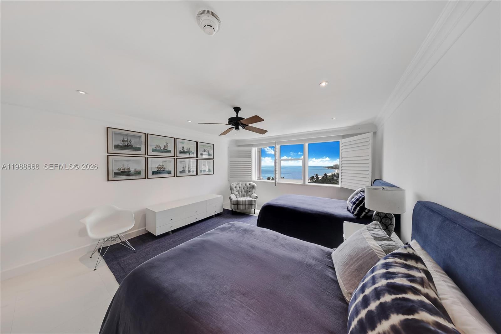 200 Ocean Ln Drive, Unit 1102 Key Biscayne, FL 33149 - Photo 13 of 24 a bedroom with a bed couch and window