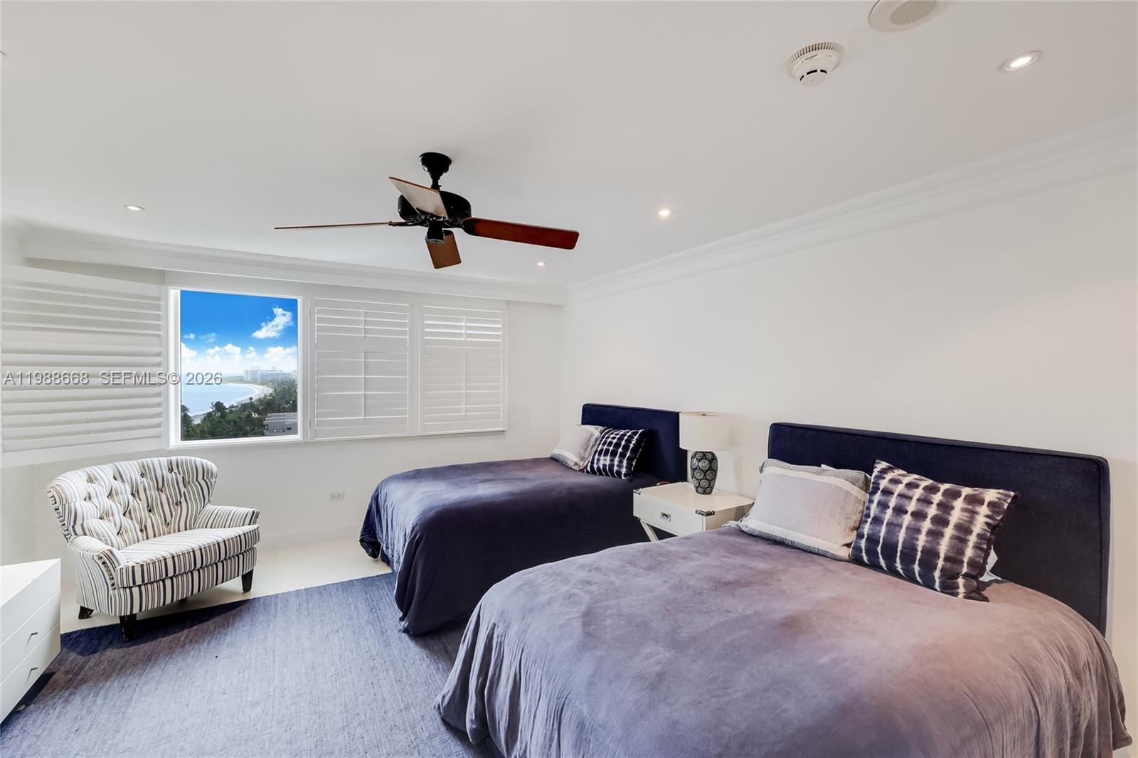 200 Ocean Ln Drive, Unit 1102 Key Biscayne, FL 33149 - Photo 15 of 24 a bedroom with two beds and a couch