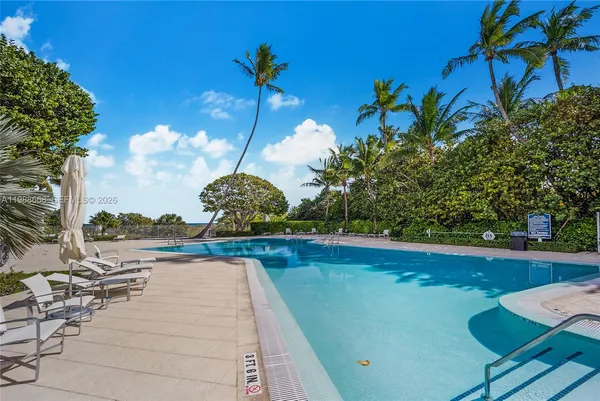a view of swimming pool from a balcony