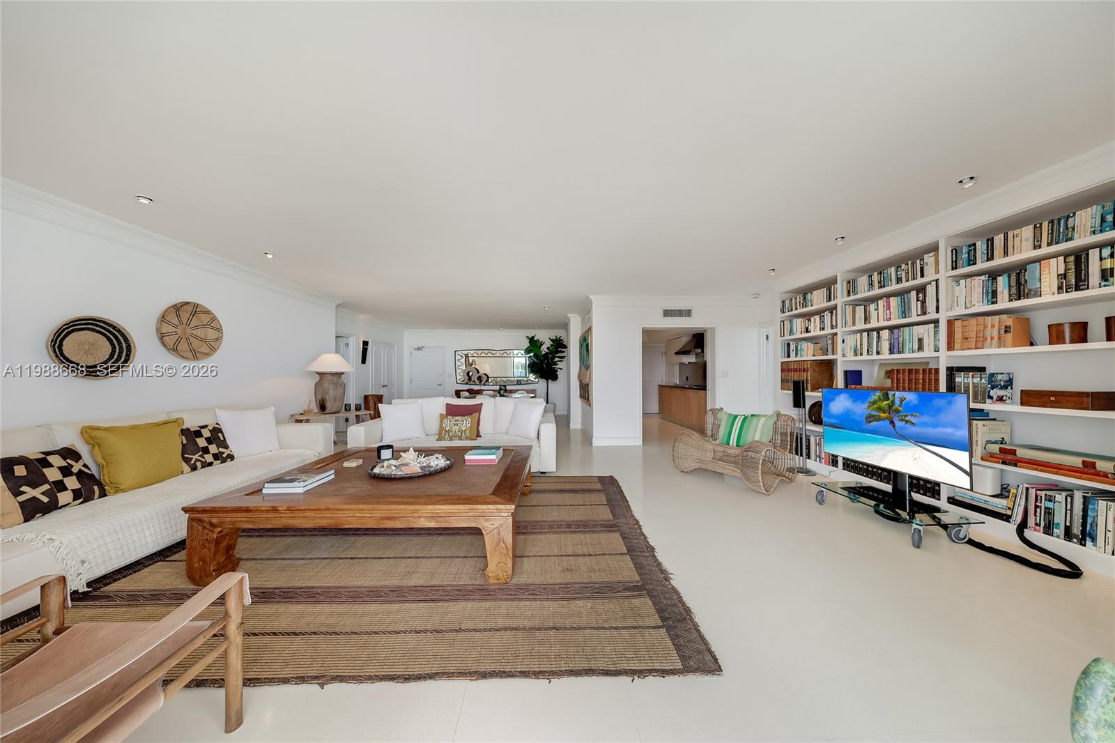 200 Ocean Ln Drive, Unit 1102 Key Biscayne, FL 33149 - Photo 3 of 24 a living room with furniture and a book shelf