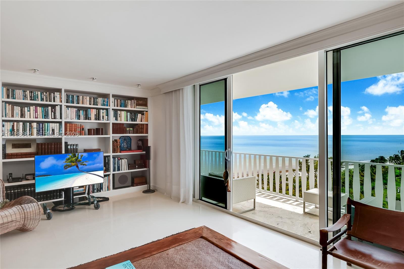 200 Ocean Ln Drive, Unit 1102 Key Biscayne, FL 33149 - Photo 4 of 24 a view of a workspace with furniture and floor to ceiling window