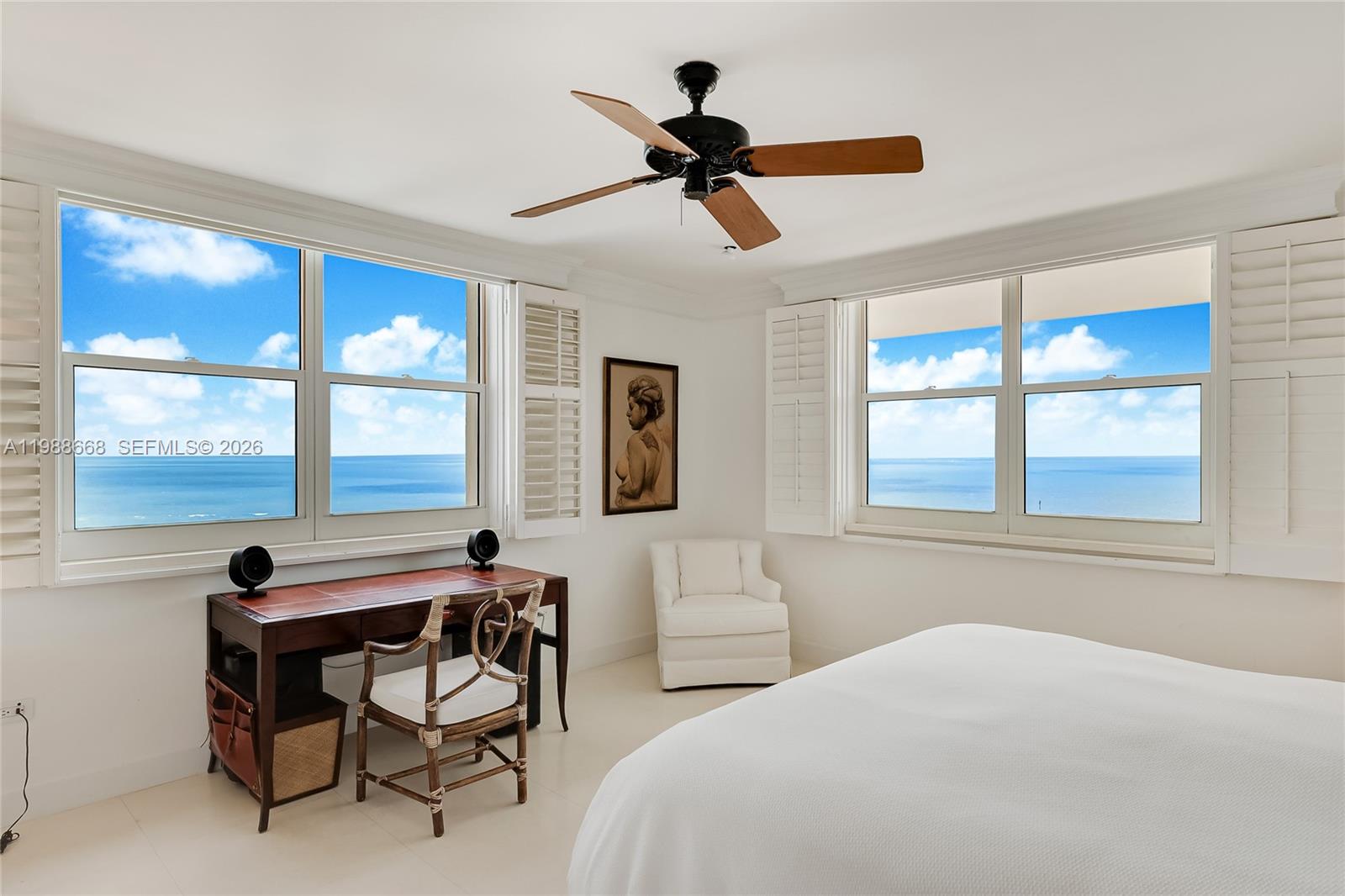 200 Ocean Ln Drive, Unit 1102 Key Biscayne, FL 33149 - Photo 10 of 24 a bedroom with a bed and a chandelier
