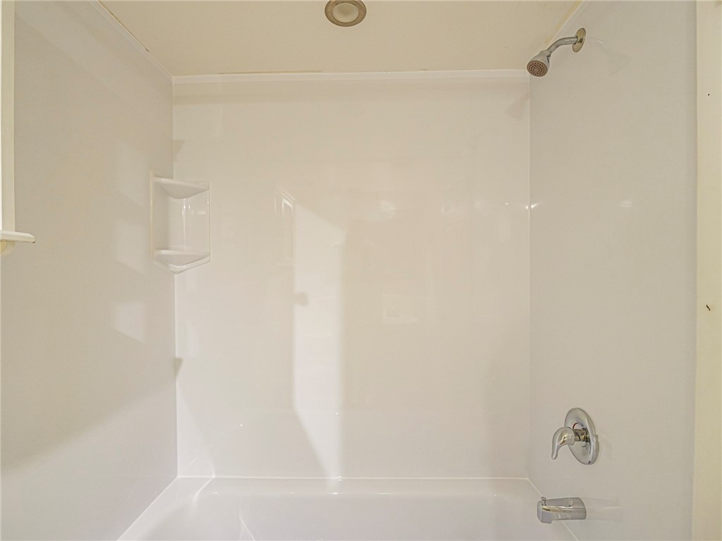 1860 Robalo Drive, Unit A105 Vero Beach, FL 32960 - Photo 20 of 35 a bathroom with a bathtub