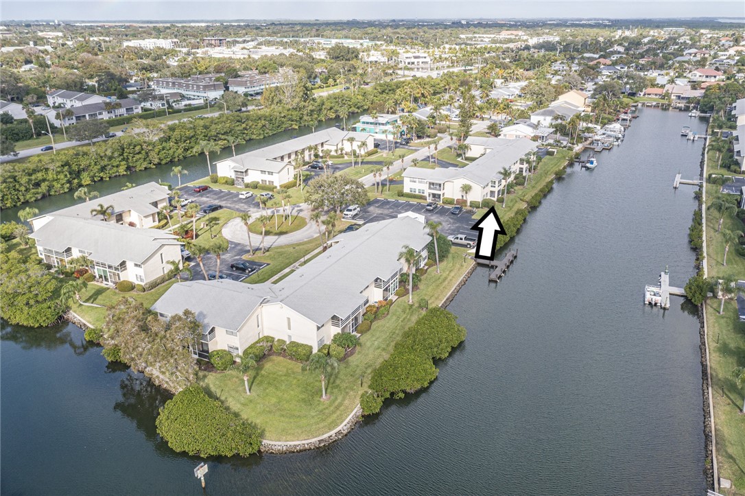 1860 Robalo Drive, Unit A105 Vero Beach, FL 32960 - Photo 33 of 35 an aerial view of a house with a lake view
