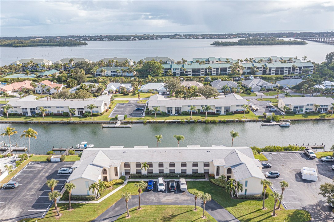 1860 Robalo Drive, Unit A105 Vero Beach, FL 32960 - Photo 35 of 35 a view of a lake with a city and a ocean view