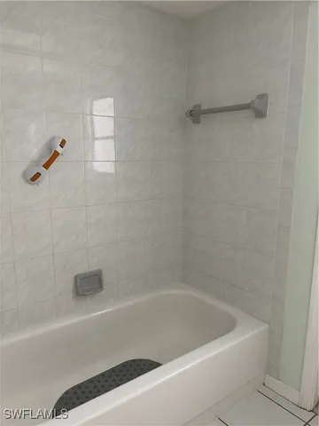a close up of a bathtub in a bathroom